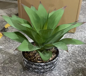 Artificial Plant Colored Green Plant in a Silver Pot